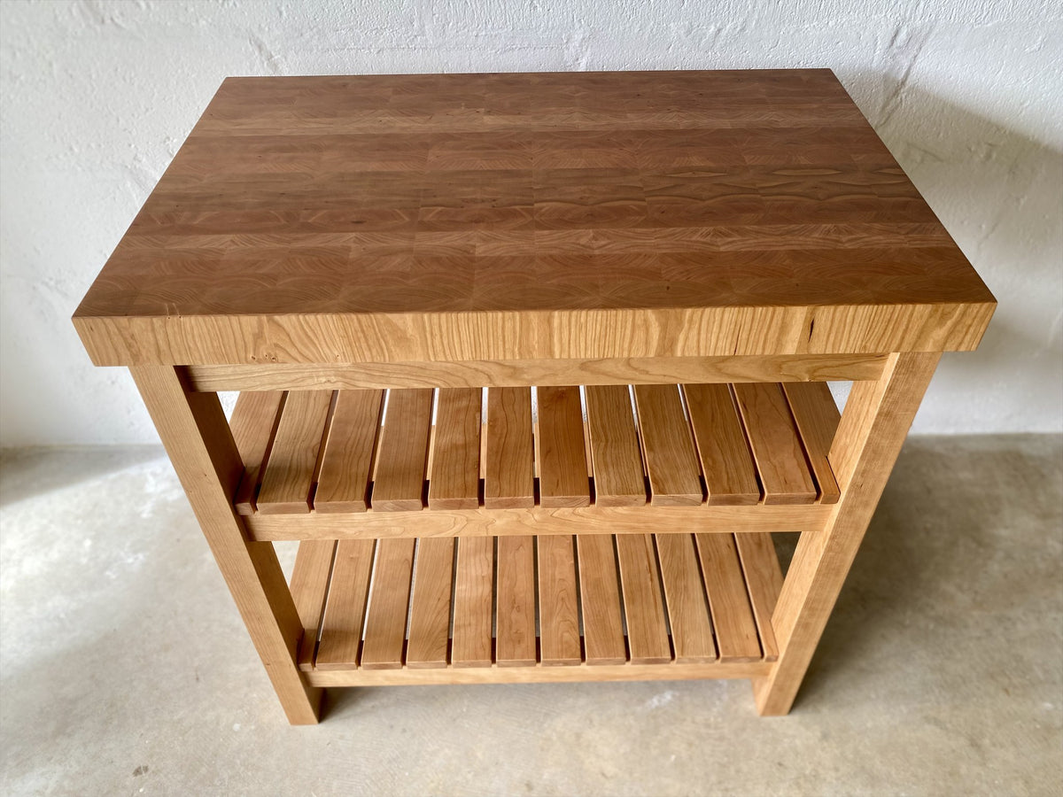 American cherry end grain butcher's island front view showing full width and slatted shelves – East Wood Design