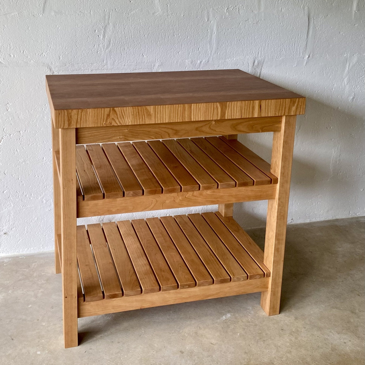 American cherry end grain butcher's island side view showing depth and lower shelf storage – East Wood Design