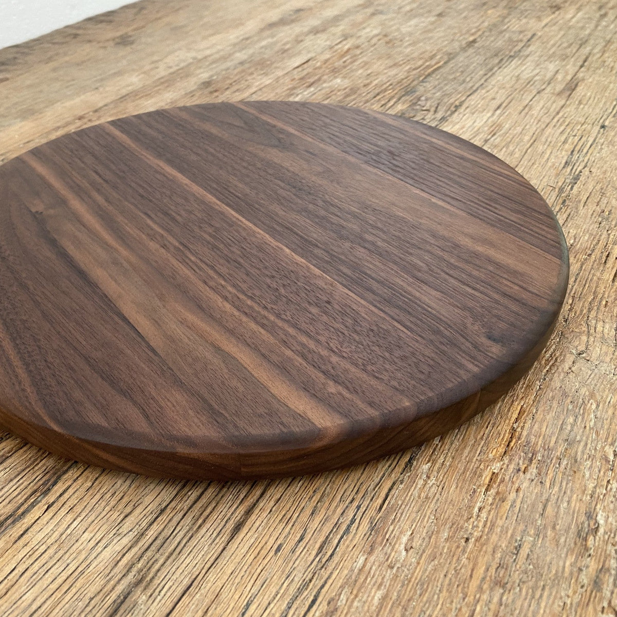 The Round Black Walnut serving board – flat lay top-down view