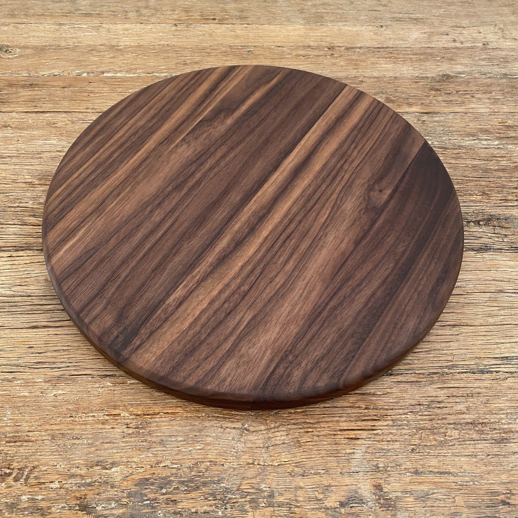 The Round Black Walnut serving board – angled view showing rich walnut grain