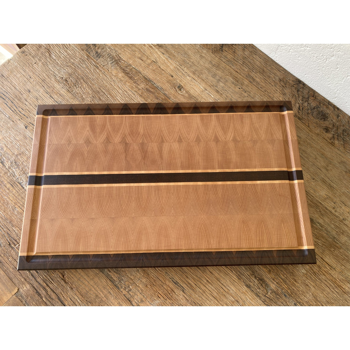 European Beech End Grain board – flat lay top-down view showing end grain pattern and walnut border