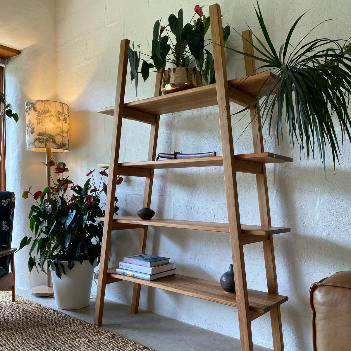 Ladder shelf stand in Pacific Rimu timber, angled side view showing shelf depth and joinery detail