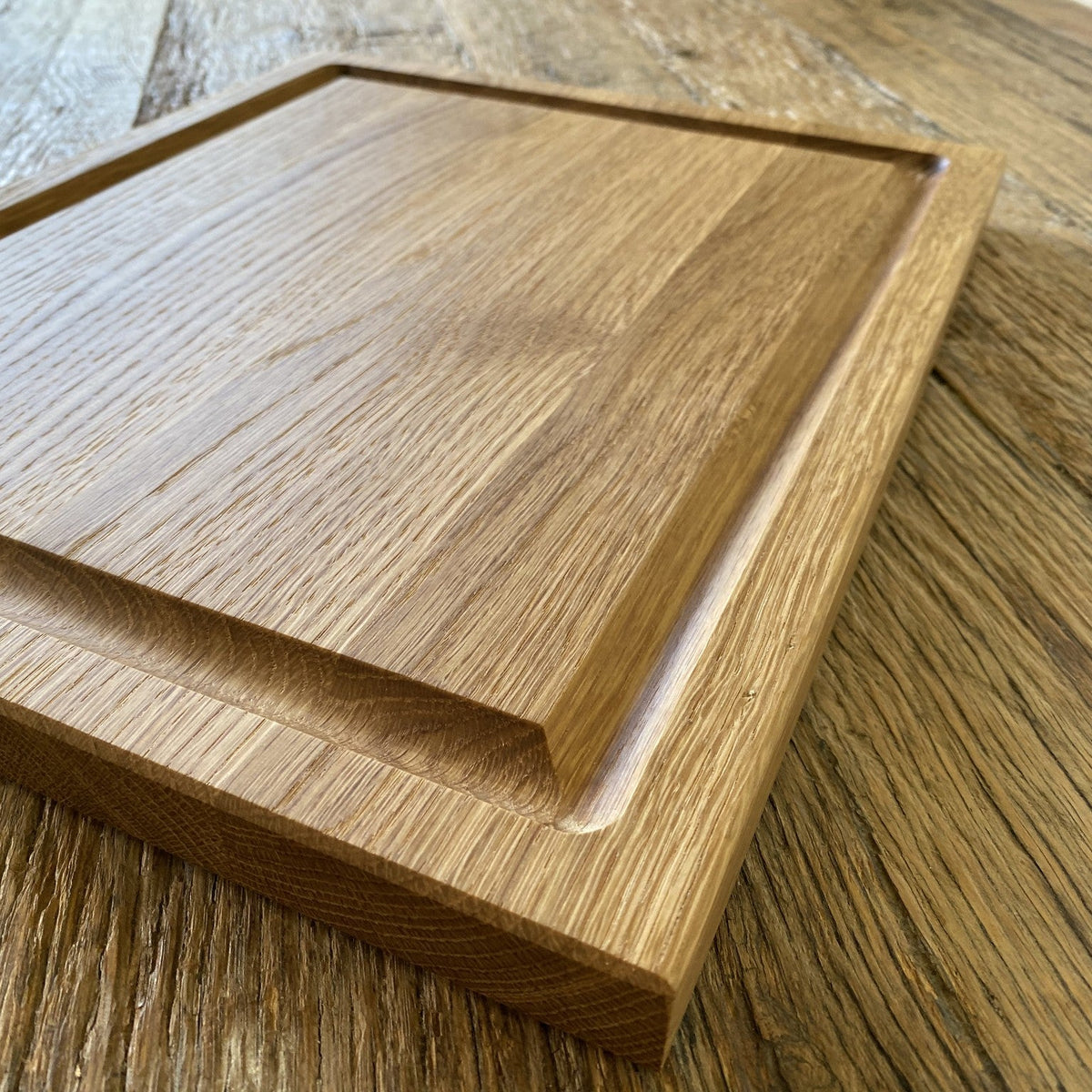 White oak carving board angled view showing chamfered edge and juice groove – East Wood Design