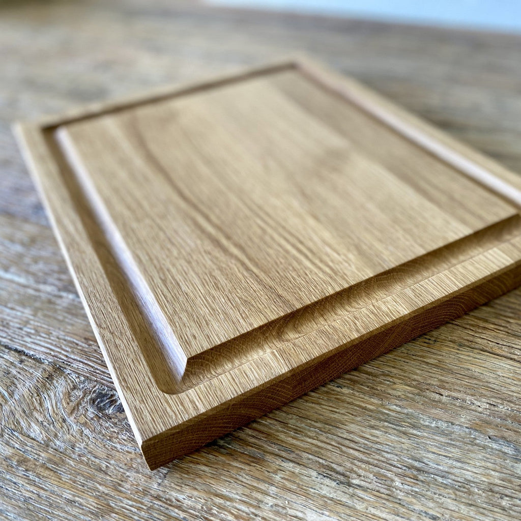 White oak carving board side angle showing thickness and routed groove on timber surface – East Wood Design