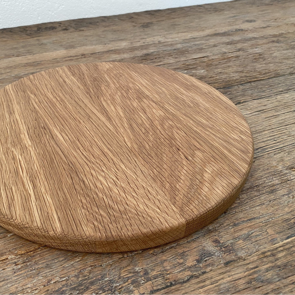 The Round White Oak serving board – angled view showing edge and grain